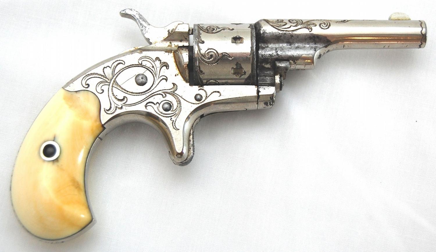 Colt Old Line open-top 7 shot revolver in 22 caliber, Factory Engraved w/ Ivory Grips